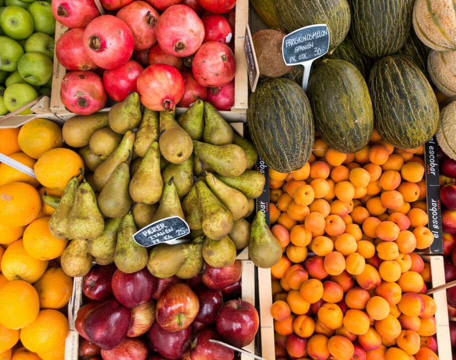 produce stands of fruits at outdoor market