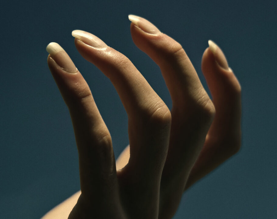 hand against a dark background