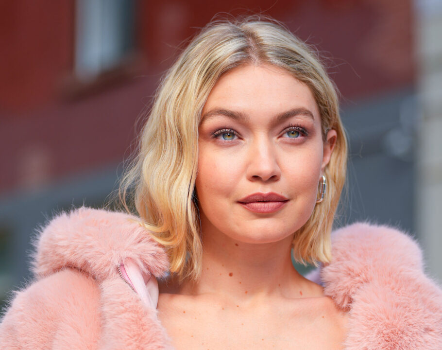 Close view of Gigi Hadid wearing a pink fur jacket