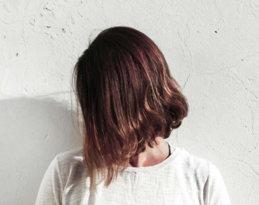 Woman with short latte brown hair