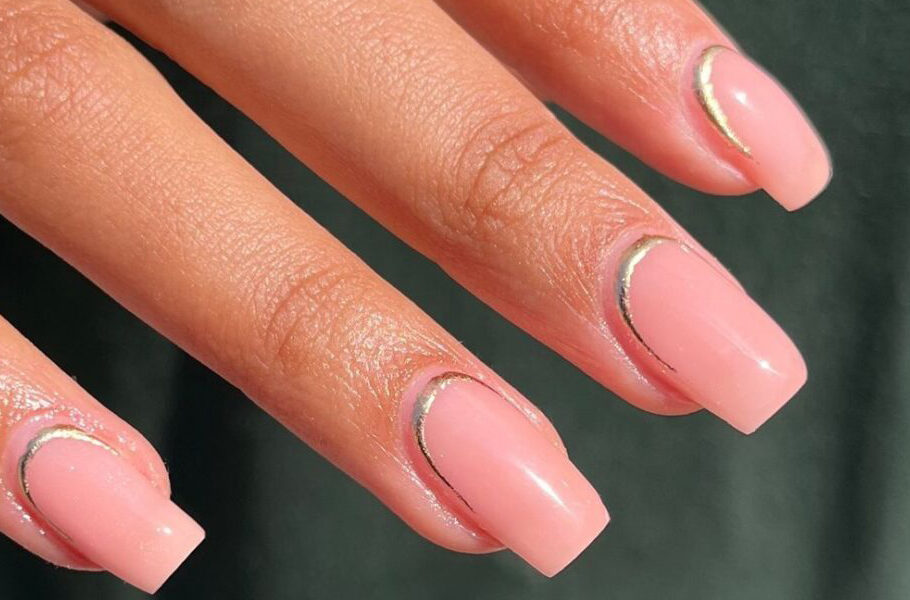 Manicured hand with a reverse french manicure