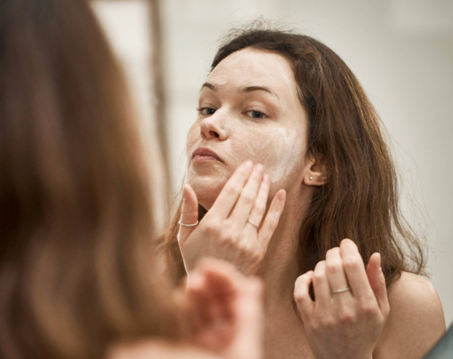 woman washing her face